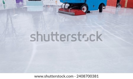 Ice cleaning machine. General and close-up of a professional machine for preparing an ice rink. Place for text. Speed skating, hockey and other winter sports