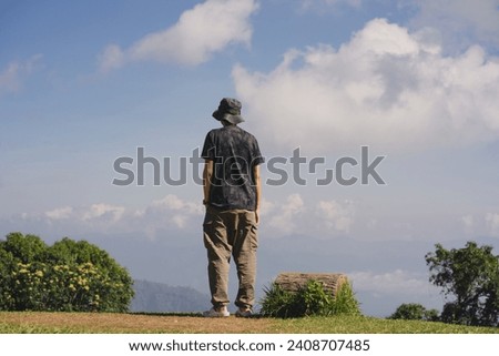 landscape and travel concept with solo freelancer man work and see sunset and twilight sky with layer of mountain