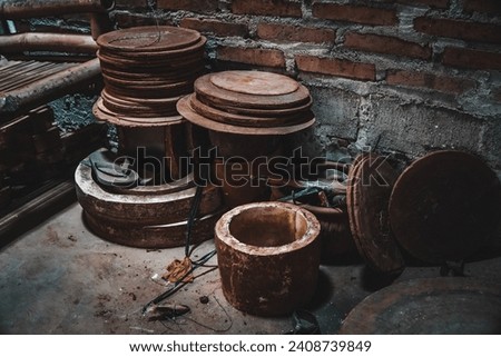 an image of pottery molding tools stacked in a corner