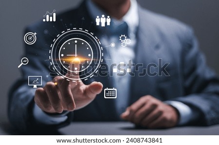Time management concept. Businessman touching clock icon on virtual to work planning for increases efficiency and reduces work time. Business project planning. Royalty-Free Stock Photo #2408743841