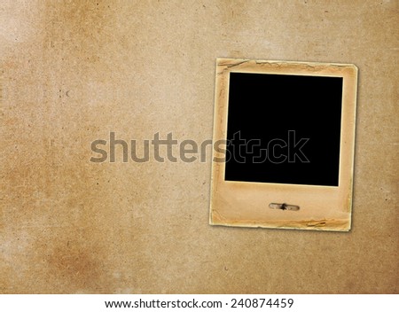 Old paper slides for photos on rusty abstract background 