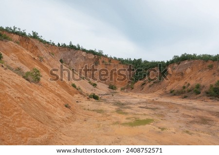 Aerial top view of ground in the land with sand in factory industry for construction site. Arid pattern texture background. Bulldozer tractor