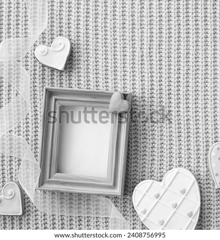 Heart Shaped Cookies on a Knitted Background. Wooden Frame for Photo. Valentine Conception. Black and white