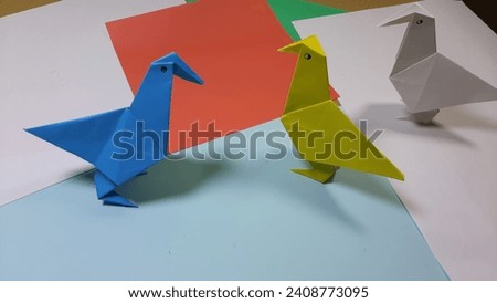 
Origami Art. three very beautiful colorful handmade paper birds, origami birds
