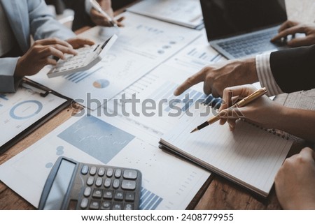 Team of analyst working on financial data analysis dashboard on paper as marketing indication for business strategic planning, Insight, They are calculating the taxes they have to pay,  Royalty-Free Stock Photo #2408779955