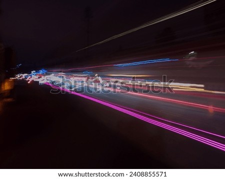 Photo of passing vehicle lights 