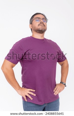 A chubby man wearing glasses looking smug and snobbish holding his head high. Half body photo, isolated on a white background. Royalty-Free Stock Photo #2408855641