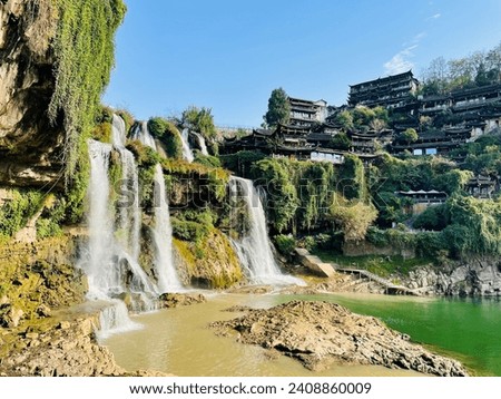 A beautiful water fall in Furong ancient town,Hunan China. Royalty-Free Stock Photo #2408860009