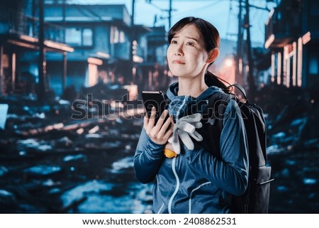 Woman in trouble when disaster strikes and phone lines are disconnected Royalty-Free Stock Photo #2408862531