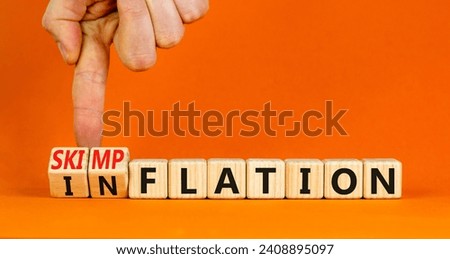 Inflation or skimpflation symbol. Concept words Inflation Skimpflation on beautiful wooden blocks. Beautiful orange background. Businessman hand. Business inflation skimpflation concept. Copy space Royalty-Free Stock Photo #2408895097