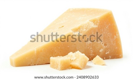Parmesan Cheese Piece -  Italian Parmigiano Reggiano Cheese - A single piece of Parmesan cheese, isolated on a white background Royalty-Free Stock Photo #2408902633