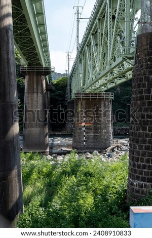 Joetsu Line bridge over the Tone River in Shibukawa City, Gunma Prefecture Royalty-Free Stock Photo #2408910833