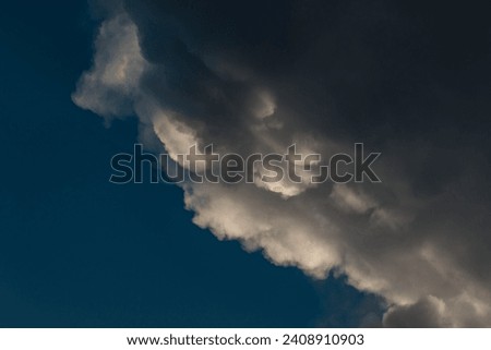 The leading edge of storm clouds from an approaching storm. Royalty-Free Stock Photo #2408910903