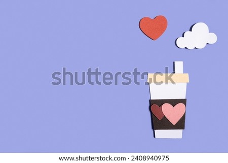 Paper handmade coffee cup with hearts on a pastel blue background. Concept for Valentine's Day, Mother's Day, World Women's Day. Romantic flat composition