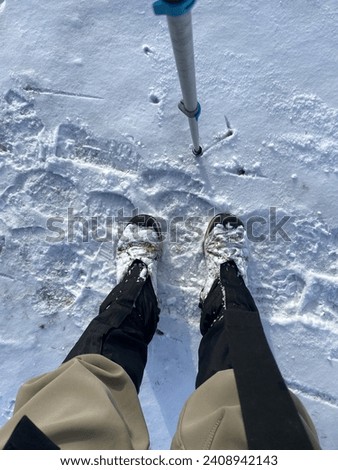 Standing in the snow with frozen boots