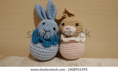 Two tied soft toys, a boy bunny and a girl bunny, photo of soft toys