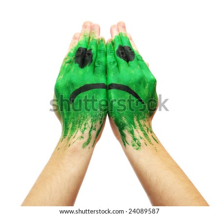 Picture of  Green sad smile mask painted on male hands isolated on white background