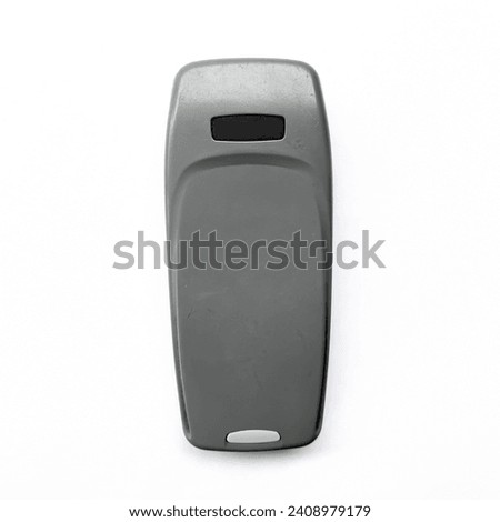 Old cell phone back view isolated on white background