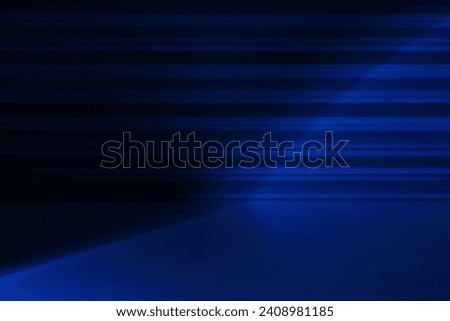 Abstract studio background with blue neon spotlight. Background stage for product displays, product demonstration. A room with a floor and a wavy metal wall.