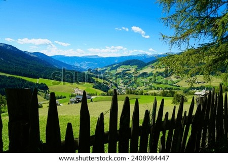Fence bordering a meadow in the South Tyrolean Dolomites