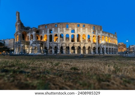 Exterior Architectural Sights of The Roman Colosseum (Colosseo Romano) in Rome, Lazio Province, Italy. (At Night). Royalty-Free Stock Photo #2408985329