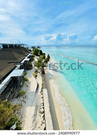 Indulge in luxury at Pom Pom Island, Malaysia. This exclusive tropical haven offers a serene oasis with a breathtaking view of the azure ocean. Relax, unwind, and embrace paradise. Royalty-Free Stock Photo #2408990977
