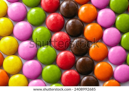 Colored bonbon chocolate dragees close-up. Background for parties and birthdays. Selective focus Royalty-Free Stock Photo #2408992685