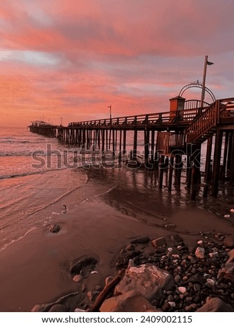 Sunrise in a small coastal village off of the Monterey Bay in California   Capitola Wharf  ￼￼ Royalty-Free Stock Photo #2409002115
