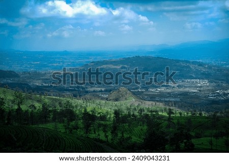 Portrait view of a small town in a valley, Central Java, Indonesia Royalty-Free Stock Photo #2409043231