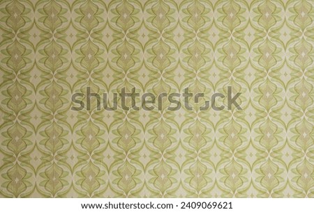 Old wallpaper on the wall. Old wallpaper for texture or background. Royalty-Free Stock Photo #2409069621