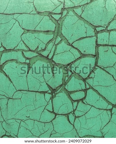 Crackling green paint on metal. Background.
