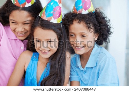 Happy, birthday party and children with hats at their home for celebration and bonding together. Smile, excited and sweet young kids at event with friendship, youth and childhood at modern house.