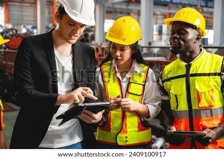 Engineer Project manager and worker labor ware reflective suit and safety helmet working in Metal sheet Industrial production line warehouse planning and see blueprint to find defect negative goods Royalty-Free Stock Photo #2409100917