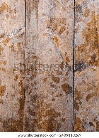 Planed floor boards with traces. Footprints on the wooden floor.