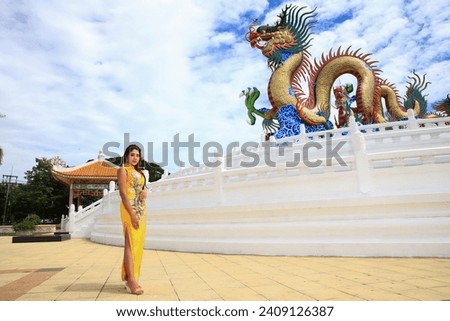 woman wearing traditional cheongsam qipao dress, Happy Chinese new year