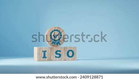 ISO quality control certification concept. wooden cubes with the abbreviation ISO with a check mark. Royalty-Free Stock Photo #2409128871