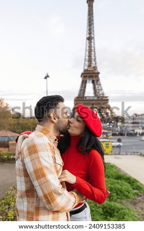 happy couple in love kissing on valentines day with eiffel tower background