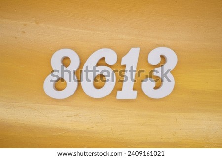 The golden yellow painted wood panel for the background, number 8613, is made from white painted wood.