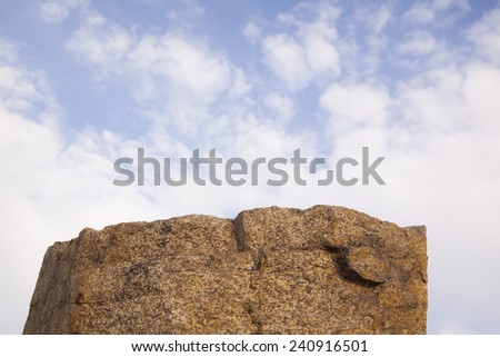 Background of high rock hill brown mountain texture against blue sky with clouds Empty Backdrop for same people or object 