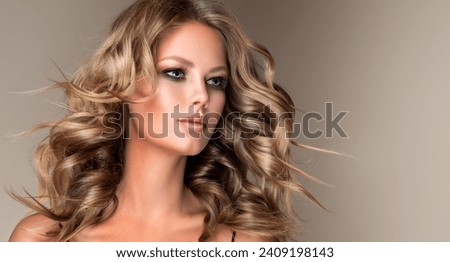 Beautiful model girl with short wavy hair .Beauty  woman with blonde curly hairstyle dye .Fashion, cosmetics and makeup
