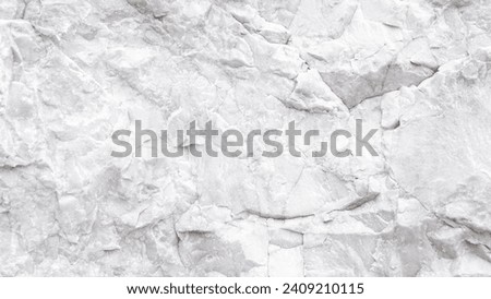 Empty black and white (light gray)  embossed stone in natural cave for abstract  background and stone texture. beautiful patterns, space for work, banner, wallpaper close up.