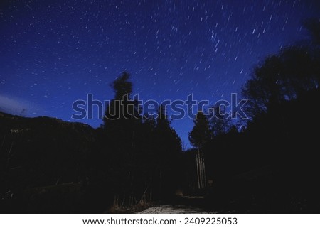 Panoramic view of the blue, clear and starry sky, seen from a slovenian mountain environment, during a night in autumn
