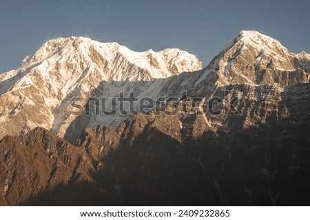View of Mt.Annapurna South (7,219 m) and Mt.Hiunchuli (6,441 m) during sunrise seen from Mardi Himal view point in the Annapurna region of Nepal.  Royalty-Free Stock Photo #2409232865
