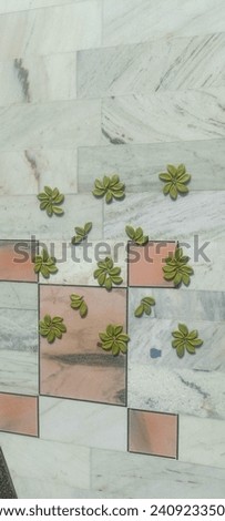 Beautiful design of made by wild tree fruits on the tile