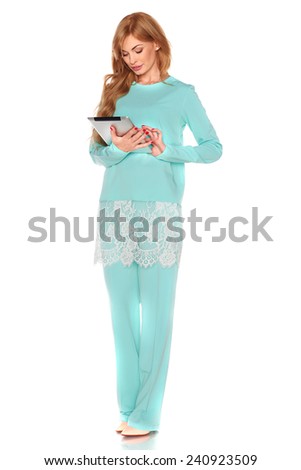 Girl in green suit with tablet computer