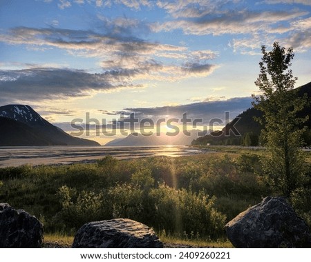 Alaskas midnight sun- summer nights  Royalty-Free Stock Photo #2409260221
