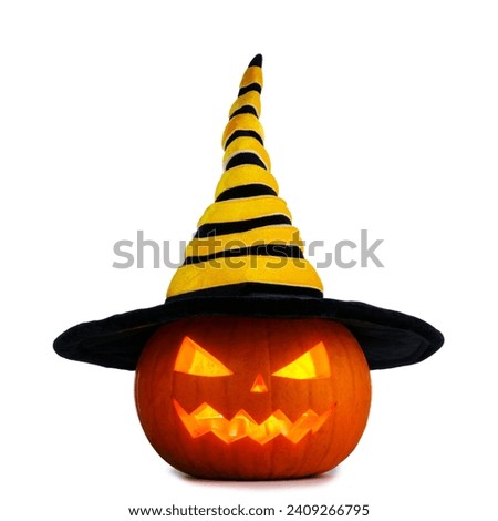 Jack O Lantern Halloween pumpkin in witches hat isolated on white background