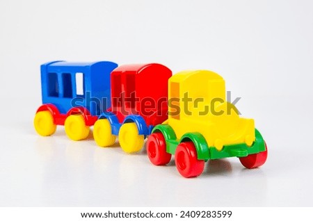 Plastic toy steam locomotive with carriages