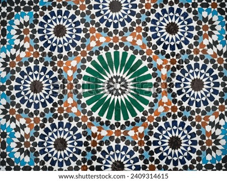 Moroccan mosaic wall tile with a Islamic geometric design. These tiles are known as zellige or zellij tiles.