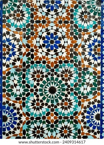 Moroccan mosaic wall tile with a Islamic geometric design. These tiles are known as zellige or zellij tiles.